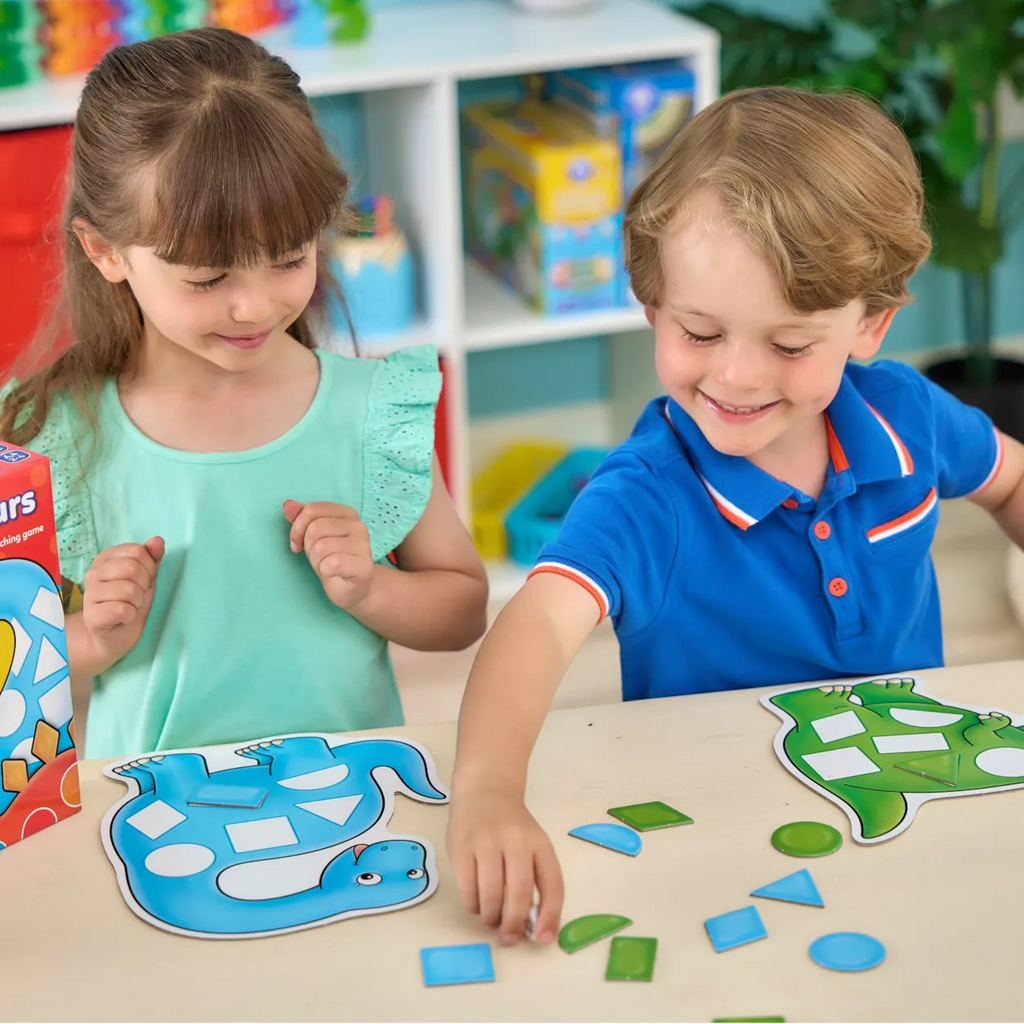 Two children playing with educational puzzle toys at a table.
