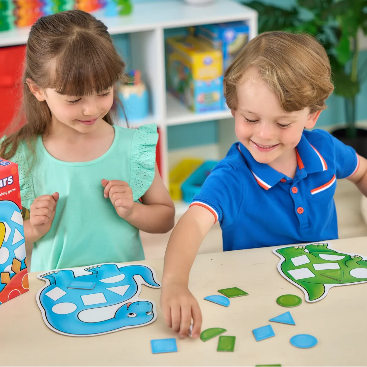 Two children playing with educational puzzle toys at a table.